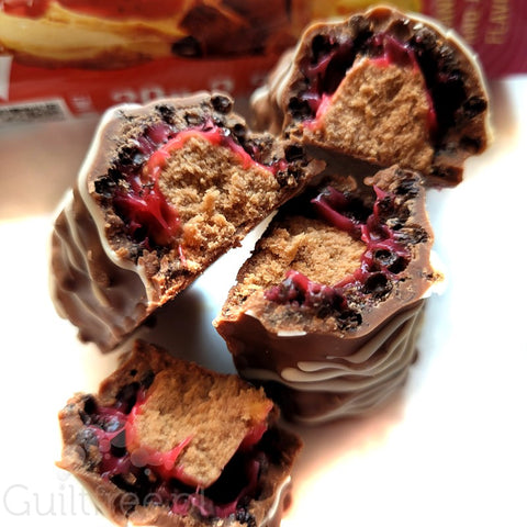 Warrior Crunch Peanut Butter and Jelly protein bar with crunchy crispies