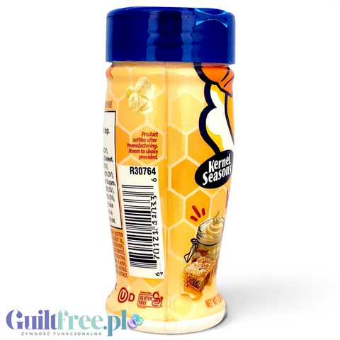 Butelka przyprawy Guiltfree Kernel Season's Honey Butter z grafiką plastra miodu i masła na żółtym tle
