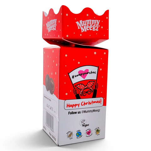 Guiltfree Mummy Meegz Choccy Balls Christmas Cracker w czerwono-białym opakowaniu z wegańskimi truflami czekoladowymi.
