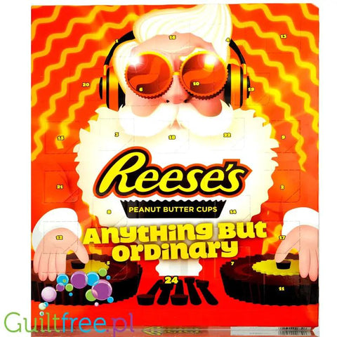 Świąteczny kalendarz adwentowy Guiltfree Reese's z 24 okienkami, pomarańczowe opakowanie z Mikołajem w słuchawkach.